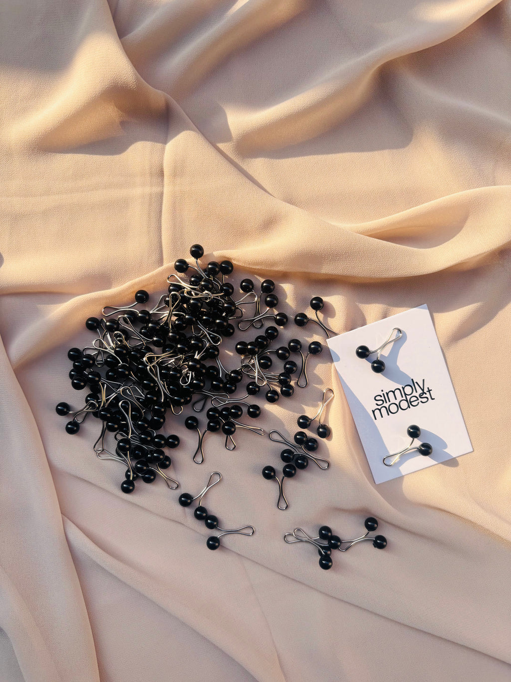 Black loop pins