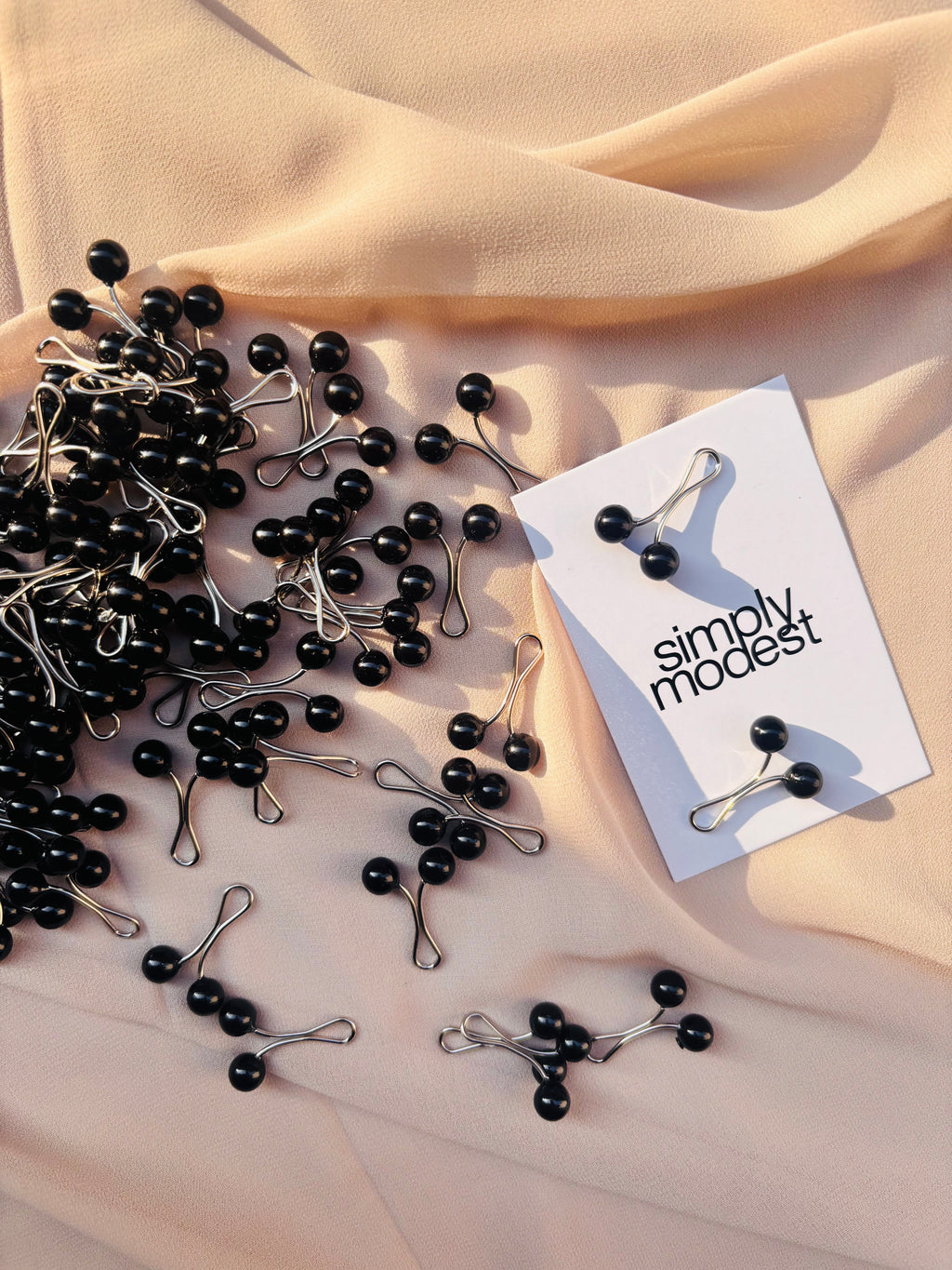 Black loop pins